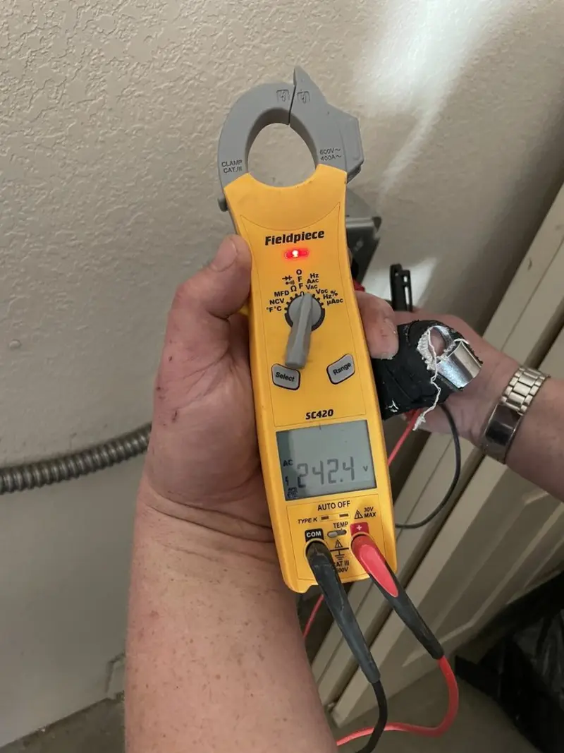 Voltage testing with clamp meter during Whole House Surge Protector in Red Springs